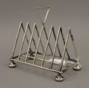 An early 20th century EPNS toast rack in the manner of Christopher Dresser. 14 cm high.