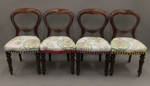 A set of four Victorian balloon back dining chairs.
