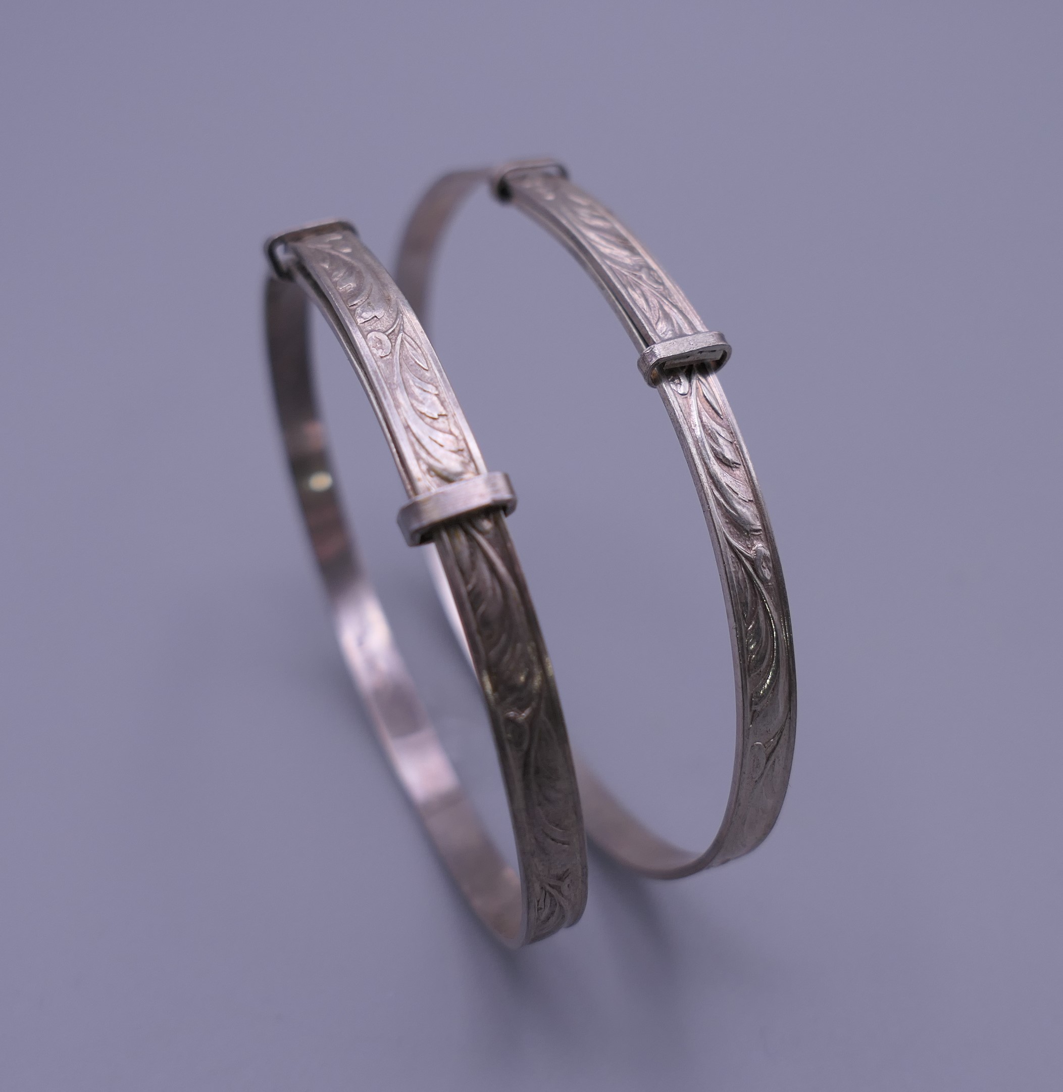 Three silver Christening bangles. The largest 6.5 cm diameter. 37.7 grammes. - Image 3 of 10