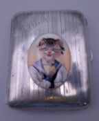 A silver cigarette case decorated with a cat in sailor's uniform. 6.5 x 8.5 cm.