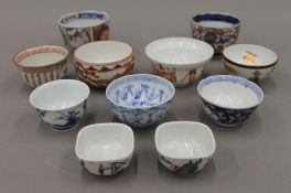 Ten various sake cups/tea bowls.