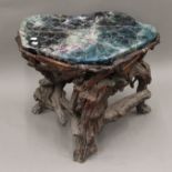 An Oriental florite and root wood stool. 51 cm high.