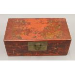 A 19th century Chinese red lacquered document box, painted with figures. 37 cm wide.