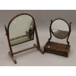 Two 19th century mahogany toilet mirrors.