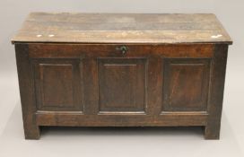 An 18th century oak three panelled coffer. 120 cm wide.