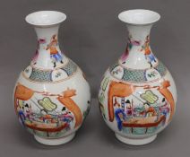 A pair of Chinese porcelain vases decorated with figures. 38 cm high.