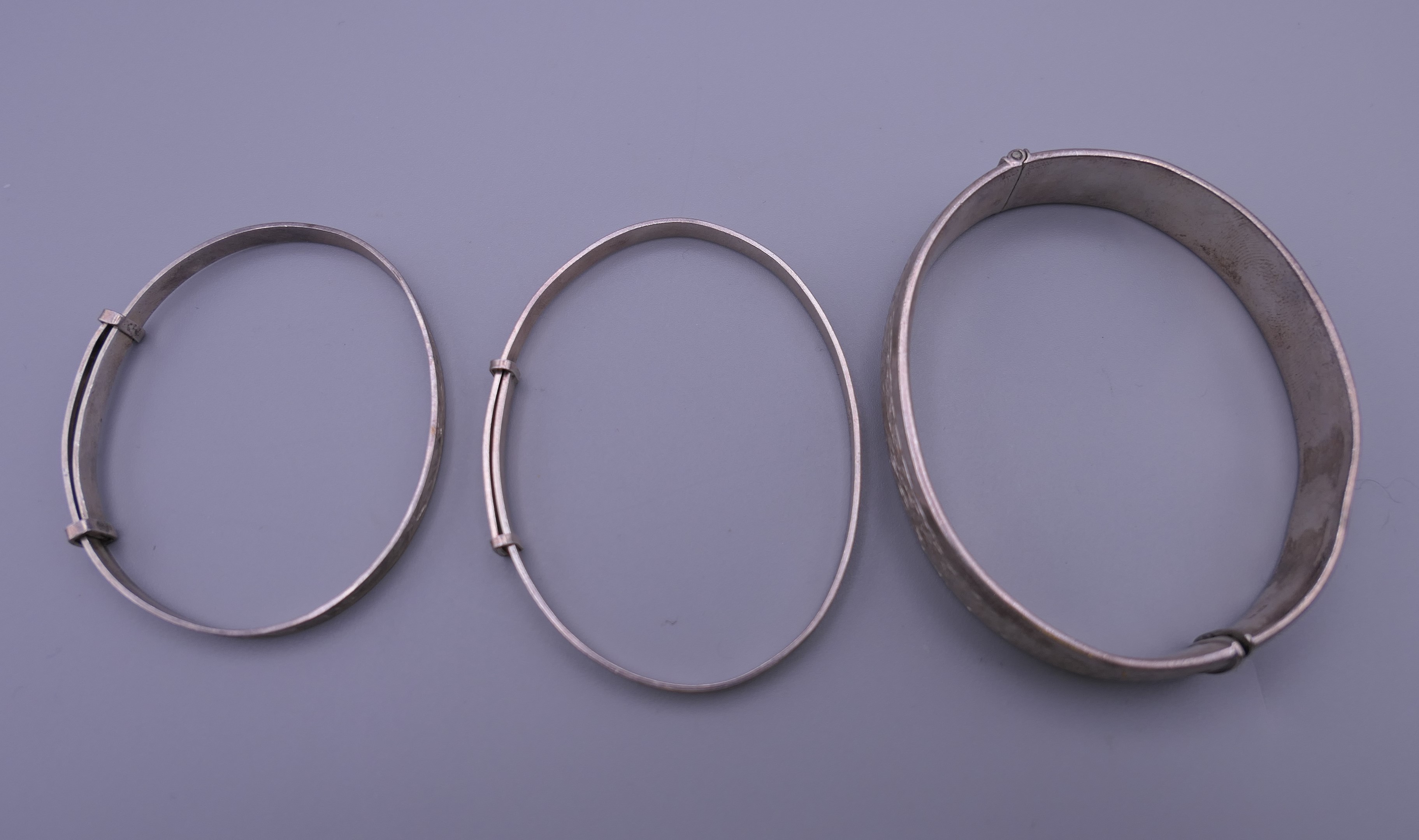 Three silver Christening bangles. The largest 6.5 cm diameter. 37.7 grammes. - Image 10 of 10