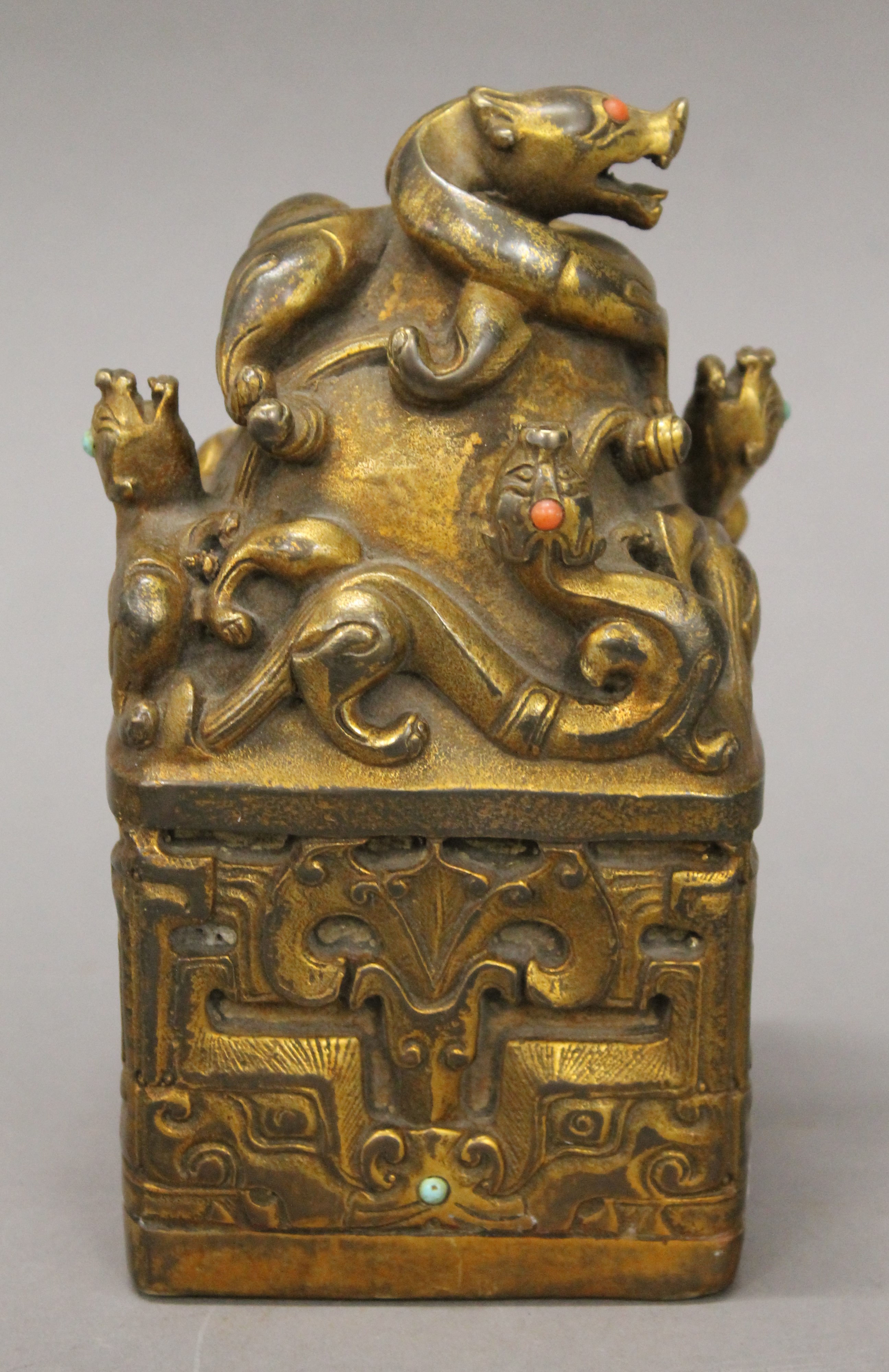 A Chinese gilt bronze seal decorated with dragons. 16.5 cm high.