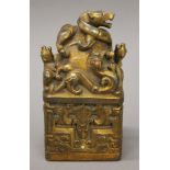 A Chinese gilt bronze seal decorated with dragons. 16.5 cm high.