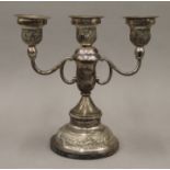 A sterling silver candelabra decorated with elephants. 20.5 cm high. 644.2 grammes total weight.