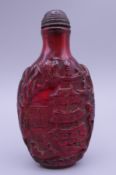 A snuff bottle. 9 cm high.