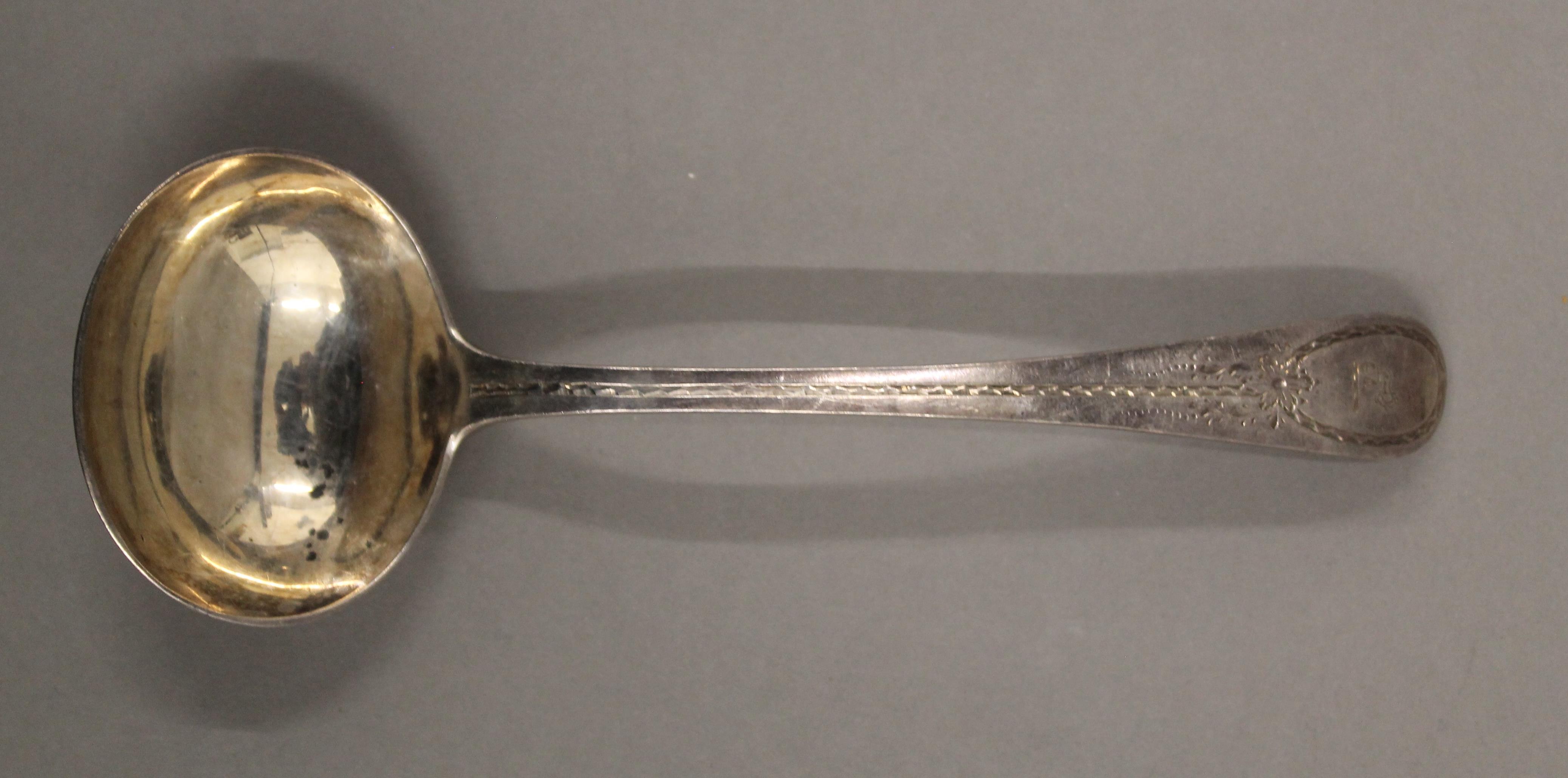 A Victorian silver ladle and a quantity of silver teaspoons. 218.7 grammes. - Image 2 of 7