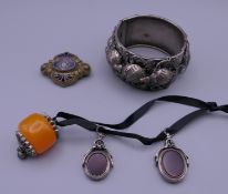 A quantity of jewellery, including two silver fobs. Fobs 2 cm high excluding suspension loop.