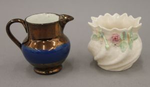 A Belleek vase and a copper lustre jug. The former 6.5 cm high.