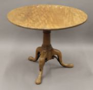 A George III mahogany birdcage tilt top tripod table. 92 cm diameter.