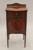 An Edwardian mahogany pot cupboard. 38 cm wide.