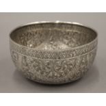 A 19th century hand tooled Thai silver bowl, stamps to base. 14 cm diameter. 115 grammes.