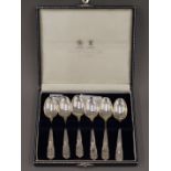 A cased set of six Mappin and Webb silver teaspoons. 134 grammes.