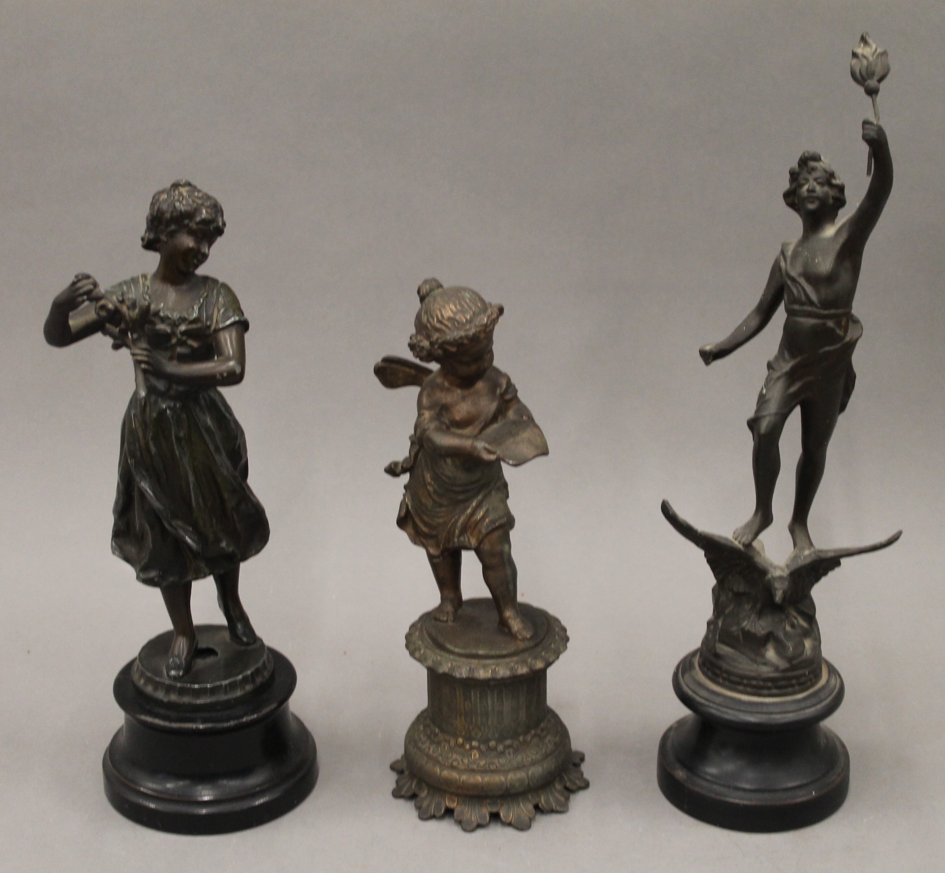 Three Victorian spelter figures.