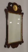 A 19th century mahogany wall glass. 67.5 cm high.