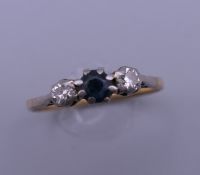 An 18 ct gold sapphire and diamond ring. Ring size P/Q.