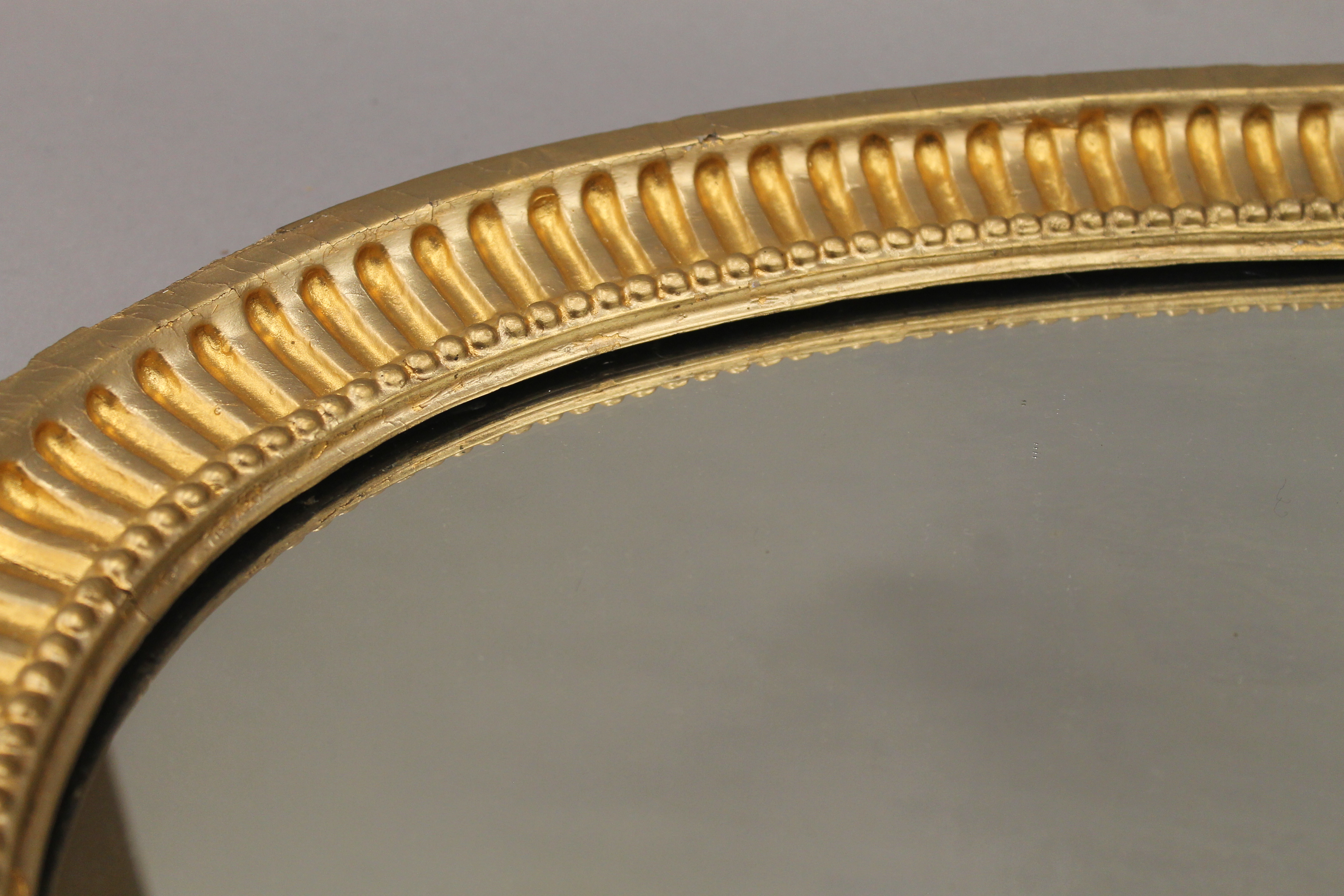 A 19th century oval gilt framed mirror. 90 cm wide, 53 cm high, 3.5 cm deep. - Image 2 of 10