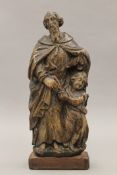 A 17th century Flemish religious carving on later base. 29 cm high.