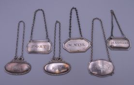 Six silver plated decanter labels, one for Rum, Sherry, Madeira, W-Wine and two Port labels.