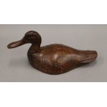 A late 19th/early 20th century carved wooden decoy duck.