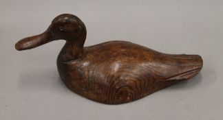 A late 19th/early 20th century carved wooden decoy duck.