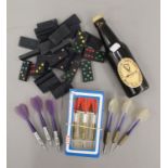 A selection of items including three sets of darts,