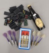 A selection of items including three sets of darts,