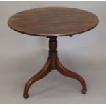A George III mahogany tilt top tripod table. 82 cm diameter.