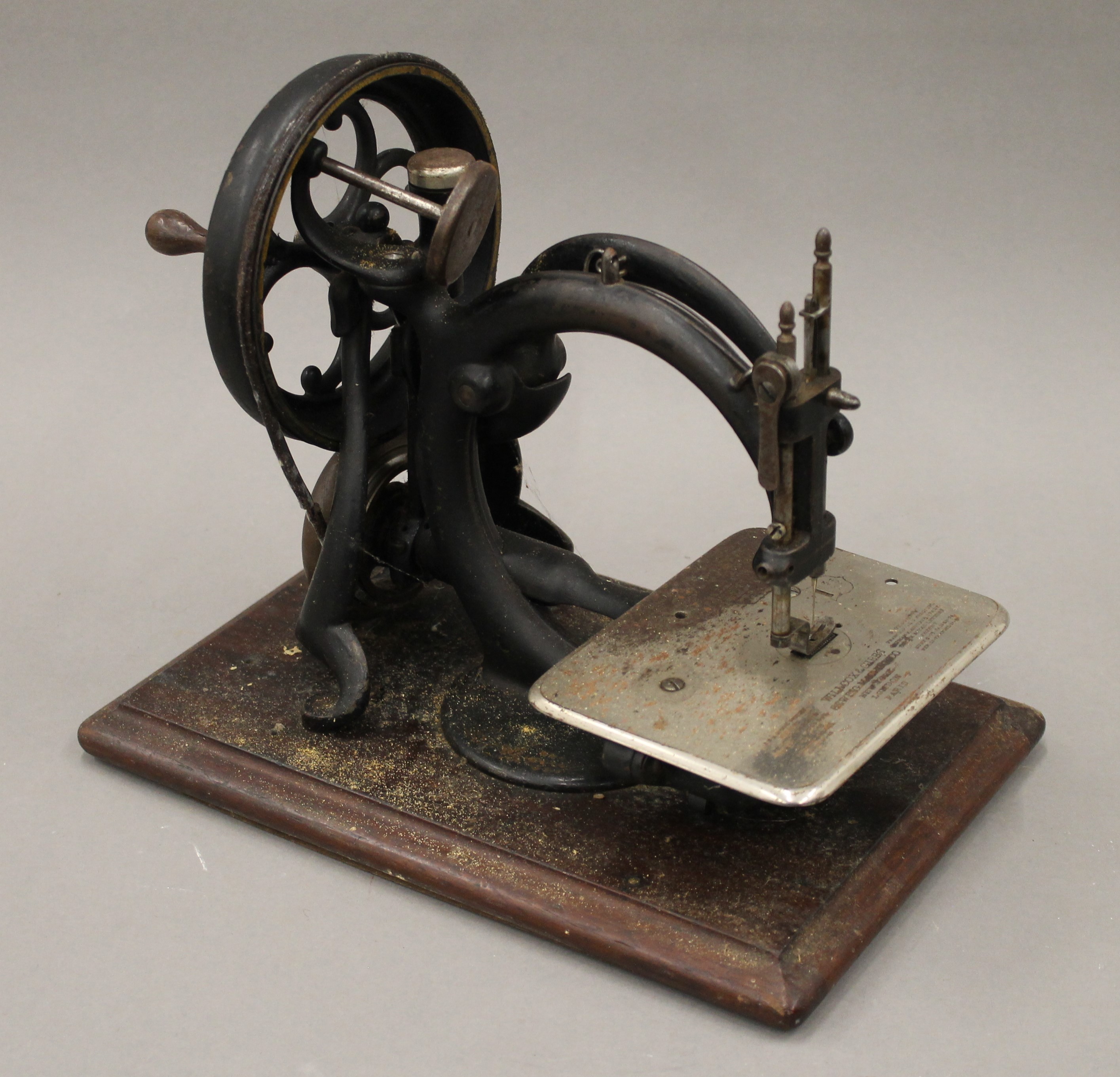 A Wilcox and Gibbs cased sewing machine. - Image 2 of 4