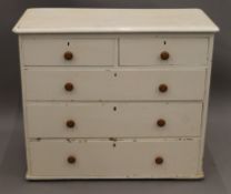 A painted pine chest of drawers. 95 cm wide.