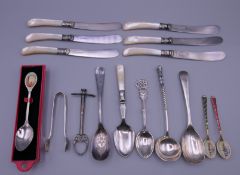 A quantity of various teaspoons and mother-of-pearl handled knives, etc. Knives 16.5 cm long.