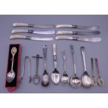 A quantity of various teaspoons and mother-of-pearl handled knives, etc. Knives 16.5 cm long.