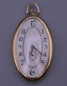 An 18 ct gold oval half hunter watch. 5.75 cm high excluding suspension loop. 51.