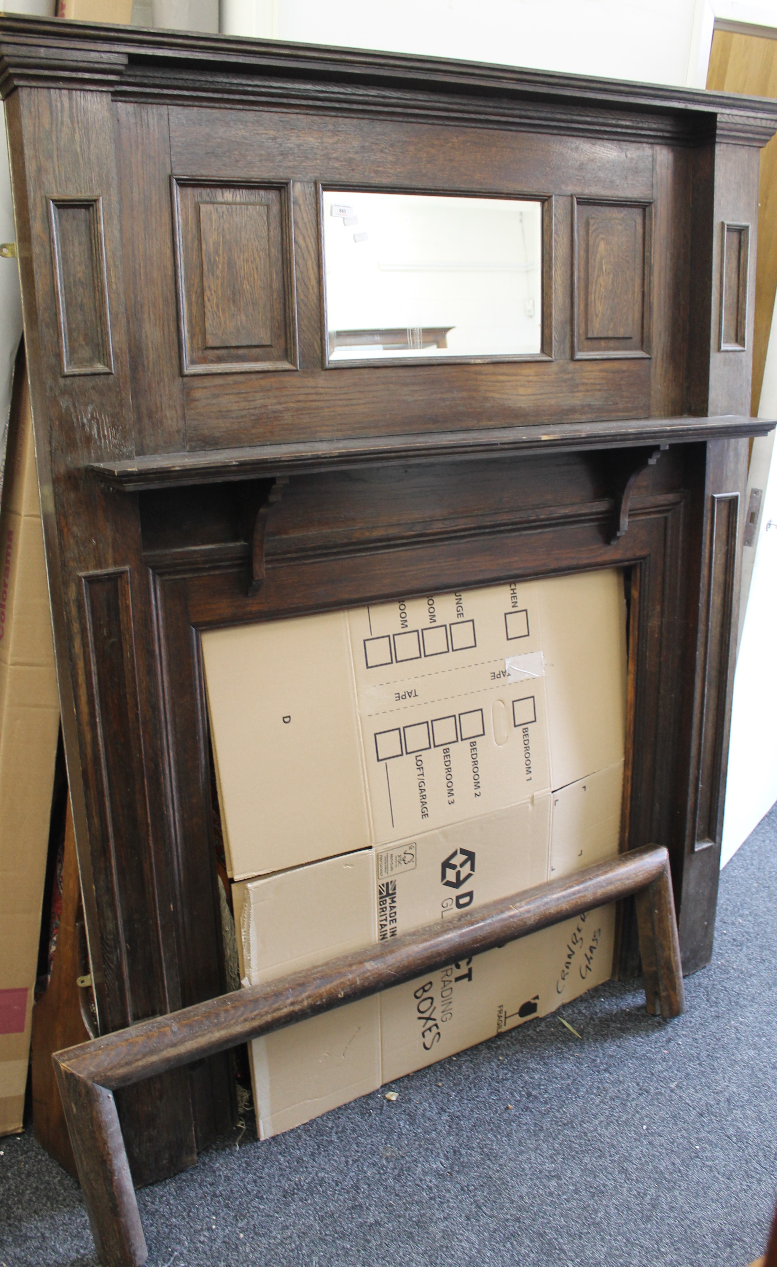 A late 19th/early 20th century oak fire surround. 149 cm wide x 183 cm high.