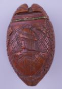 A coquilla nut snuff box. 7.5 cm x 4.5 cm.