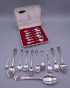 A boxed set of six silver teaspoons, and other silver plated spoons. Set of spoons each 9.