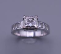 An 18 ct gold princess cut diamond solitaire ring. Diamond 0.5 carat. Ring size N.