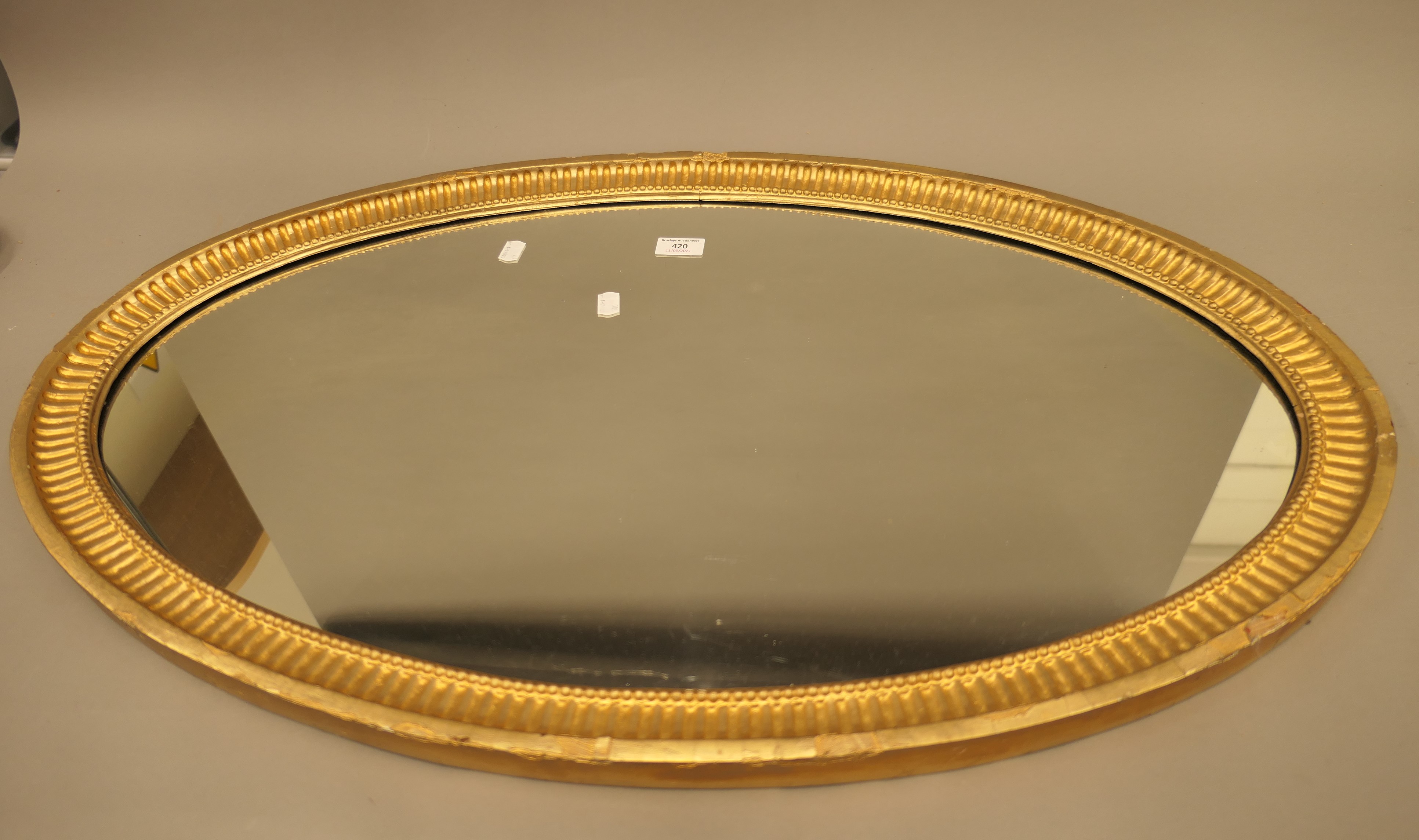 A 19th century oval gilt framed mirror. 90 cm wide, 53 cm high, 3.5 cm deep. - Image 9 of 10