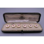 A boxed set of six 18 ct gold studs, in a Goldsmiths & Silversmiths Company Ltd fitted case.