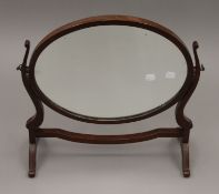 A Victorian mahogany toilet mirror. 51 cm wide.