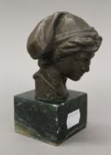 A small bronze bust on marble base. 13 cm high.
