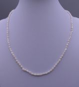 A seed pearl necklace. 41 cm long.