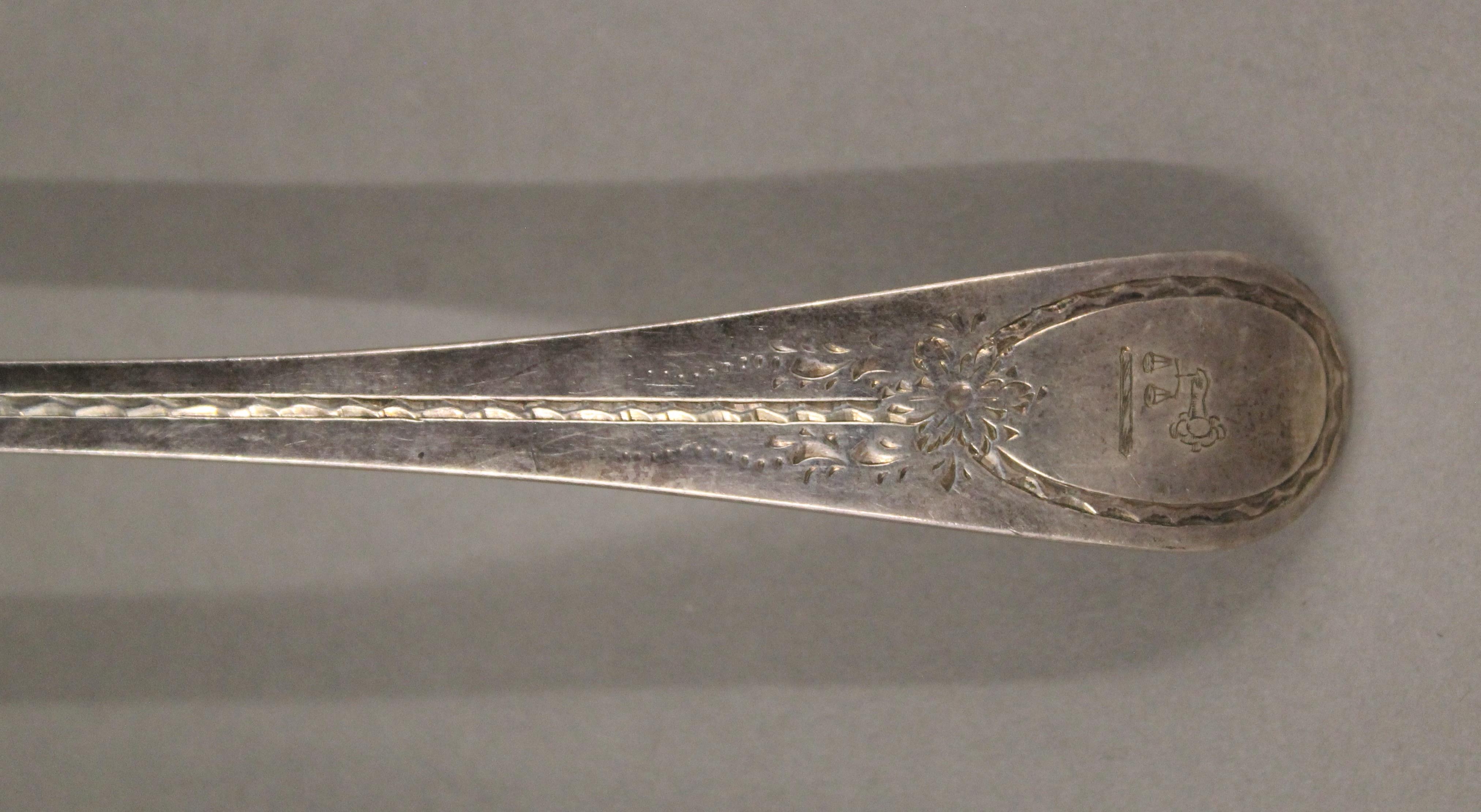 A Victorian silver ladle and a quantity of silver teaspoons. 218.7 grammes. - Image 3 of 7