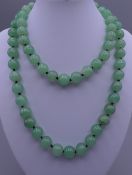 A jade bead necklace. Approximately 92 cm long.