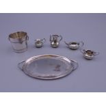 Six pieces of silver dolls house items. Tray 6 cm wide including handles, ice bucket 2 cm high. 25.